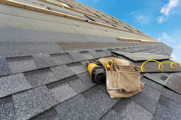 istock Asphalt tile roof and tool belt lying on new house under construction 1172013157