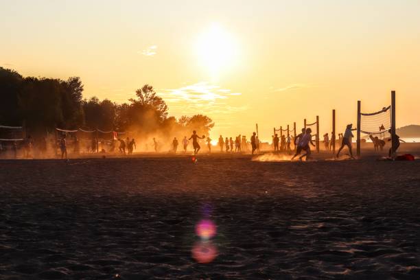 Volleyball on the beach under sunset
