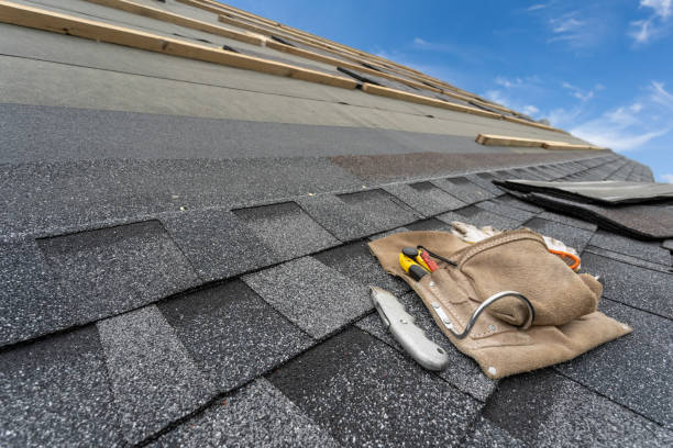 istock Asphalt tile roof and tool belt lying on new house under construction 1172013339