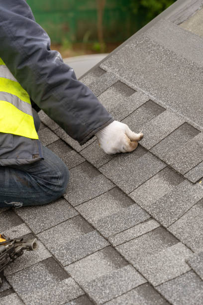 istock Workman install tile on roof of new house under construction 1172013423