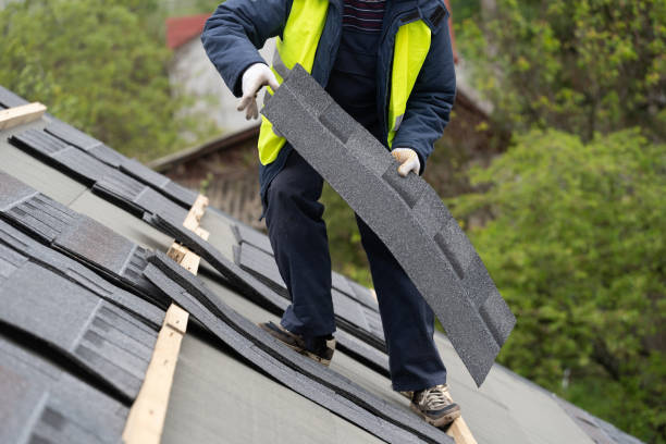 istock Workman install tile on roof of new house under construction 1172013472