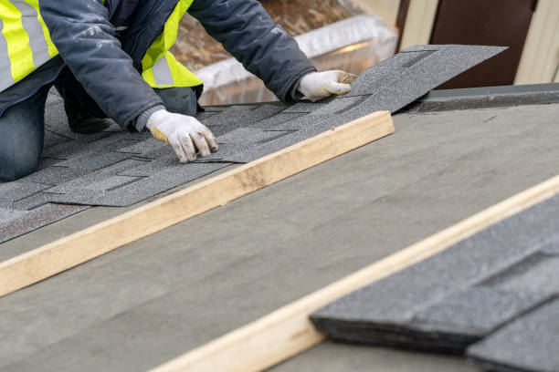 istock Workman install tile on roof of new house under construction 1172013523