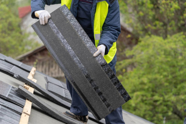 istock Workman install tile on roof of new house under construction 1172013528