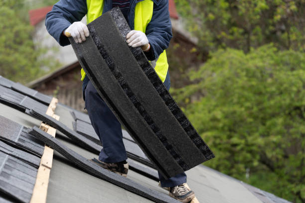 istock Workman install tile on roof of new house under construction 1172013688