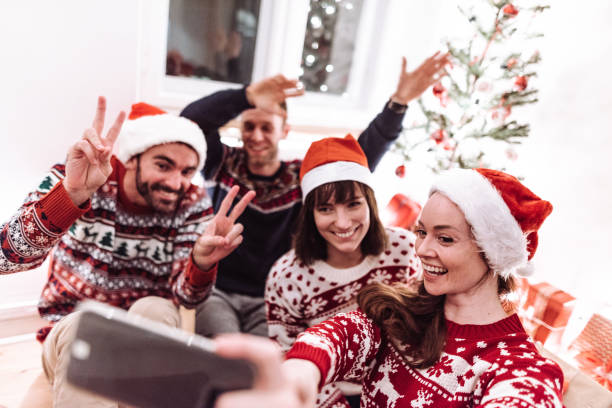 istock friends using smartphones at christmas 1172015183