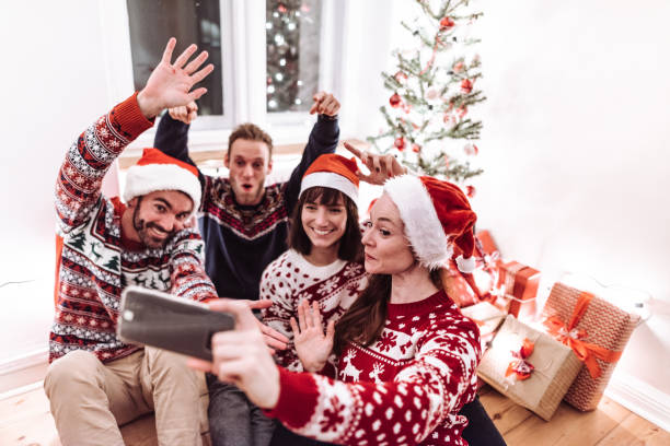 istock friends using smartphones at christmas 1172016662