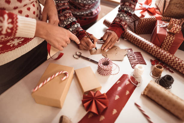 istock couple preparing christmas presents 1172018473