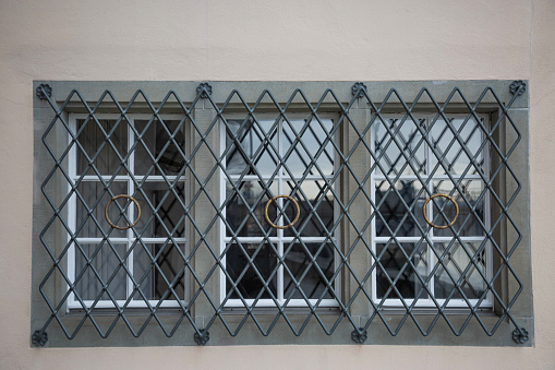 Lattice in front of a window on a facade