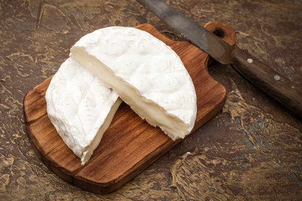 istock Soft mold cheese on a cutting board with a knife. Snack to wine 1172020671