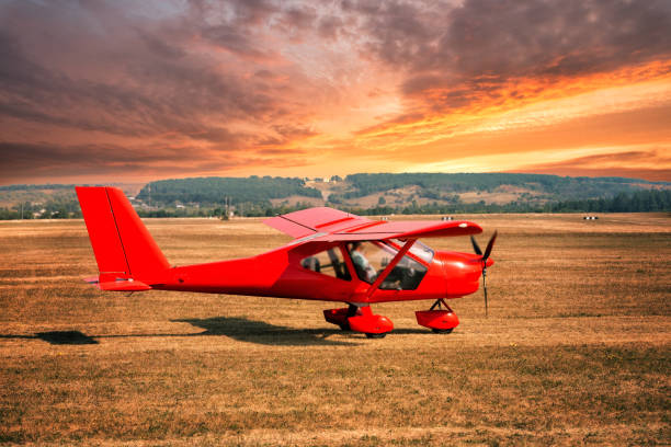 istock Red airplane at the airport 1172021788