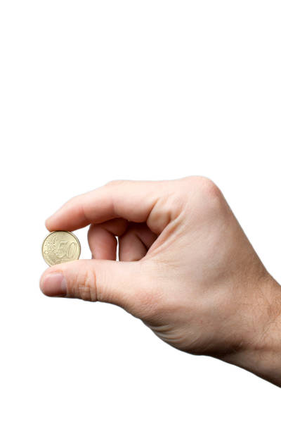 istock Male fingers holding a 2€ coin 1172025182