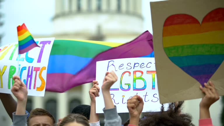 Crowd raising posters chanting to respect LGBT rights, support for gay marriage