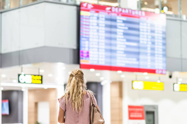 istock Checking the schedule at the airport 1172033913