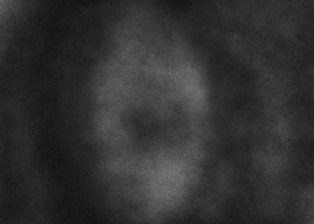 istock Dark noise texture. Gritty grunge background with black paint spots on paper 1172041207