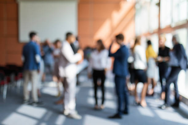 Business conference background A blurred image of a group of business people attending a meeting delegate stock pictures, royalty-free photos & images