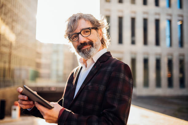 istock Senior businessman holding a tablet 1172046108