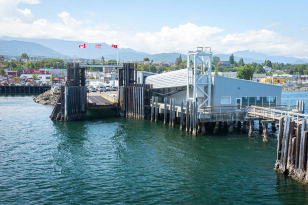 Washington, USA - July 23, 2015: Ferry crossing the sea from Vicitoria on Vancouver Island is advancing toward the port at Port Angeles on a summer day.