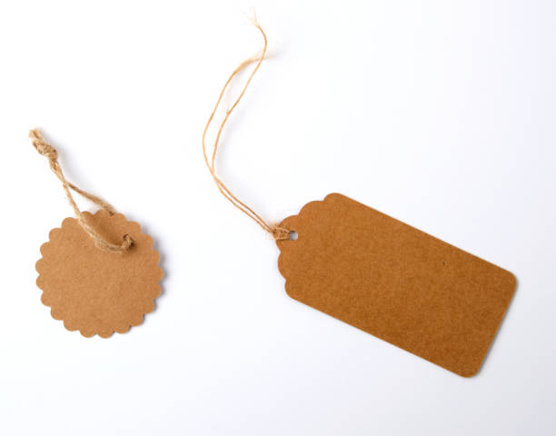 istock various brown paper tags with ropes on white background 1172053161