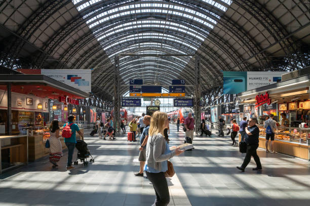 Frankfurt, Germany - July 2019: Frankfurt Main Train station architecture and people around. The railway station has opened in 1899 and is the biggest in Germany.