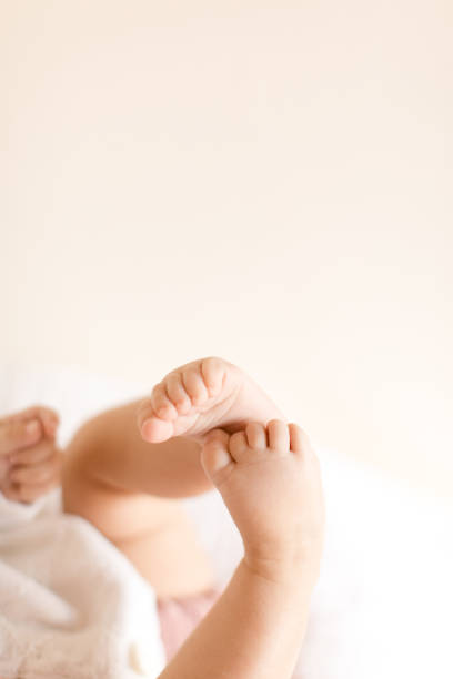 5-month-old baby legs in the air.