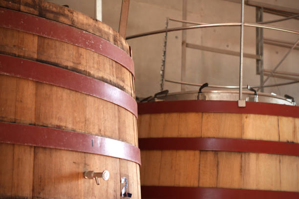 istock Large wooden wine barrels with steel hoops 1172060779