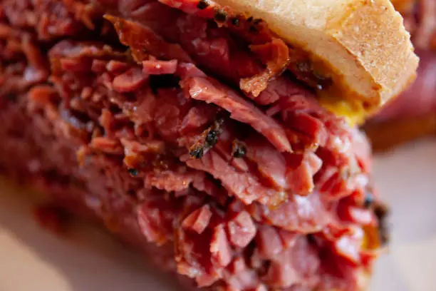 Close up of a Montreal Smoked meat sandwich.