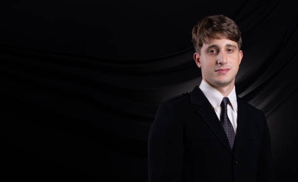 istock Business Man Stand in dark Black proper Suit 1172076386