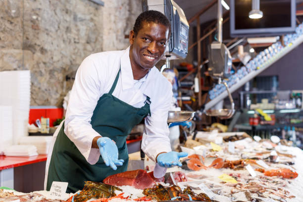 istock Salesman portrait in fish shop 1172081023