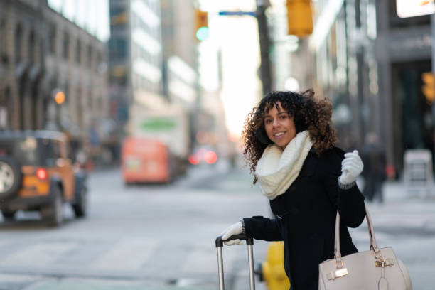 istock Woman on sidewalk waits for her ride 1172083237