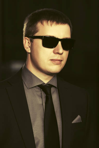 istock Young handsome business man in sunglasses 1172083333