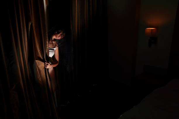 istock ghost woman in haunted hotel with dark filter, halloween concept 1172085106