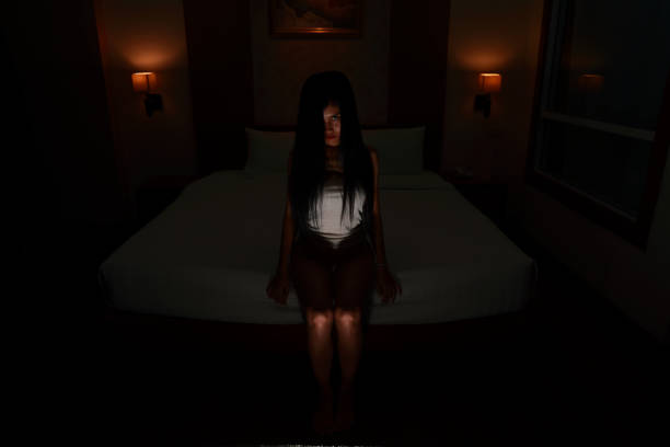 istock ghost woman in haunted hotel with dark filter, halloween concept 1172085107