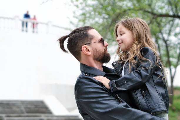 istock Dad and daughter walk around the city 1172094860