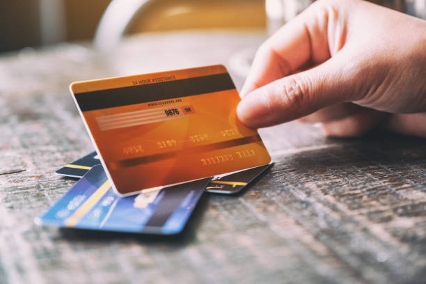 istock a hand holding credit card 1172101505