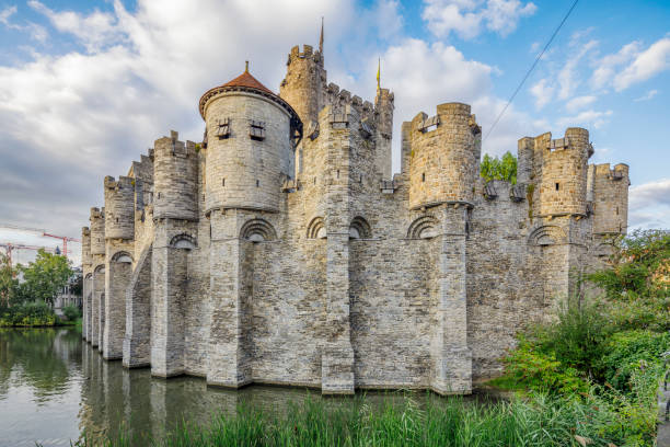 The entrance of the medieval castle Het Steen (The Stone), in Antwerp, Belgium, showing the flags of Antwerp, EU and, Flanders and Belgium