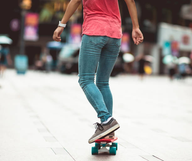 istock Skateboarder legs skateboarding at city 1172109633