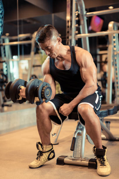istock Mature man doing training in personal training gym 1172119534