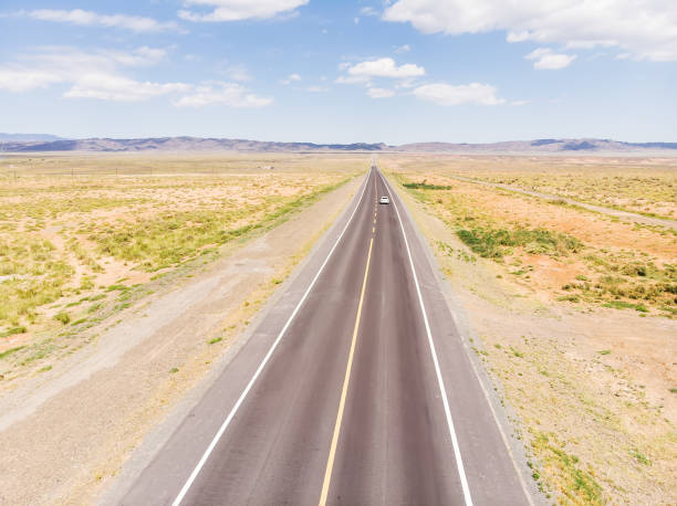 istock Aerial view of road in desert 1172120520