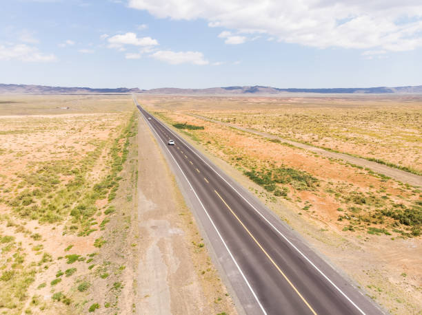 istock Aerial view of road in desert 1172120621