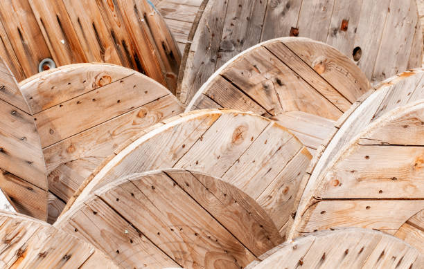 istock empty wooden cable drums stored beside construction site 1172125793