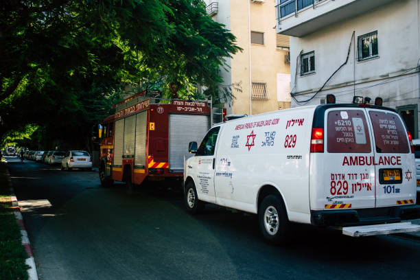 colors of Israel Tel Aviv Israel August 24, 2019 View of Israeli ambulance and fire engine parked in the streets of Tel Aviv in the afternoon ambulance in israel stock pictures, royalty-free photos & images