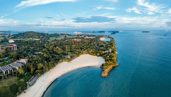 The tropical island of Sentosa in Singapore have many beautiful beaches and is surrounded by the Pacific Ocean and lush rainforest.