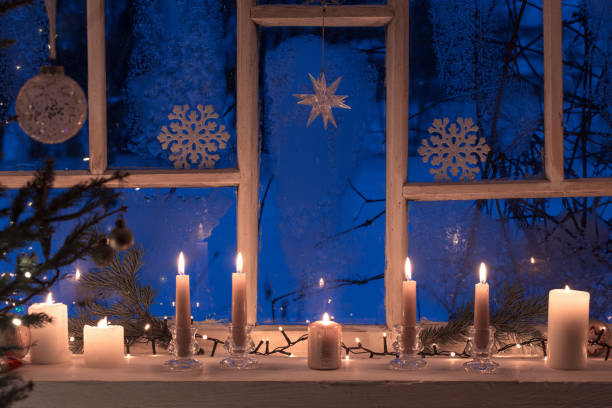 istock Christmas decorations on old wooden window 1172130241