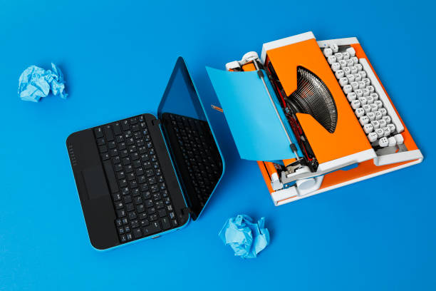 istock Digital and analog – Laptop and 70s Typewriter 1172133240