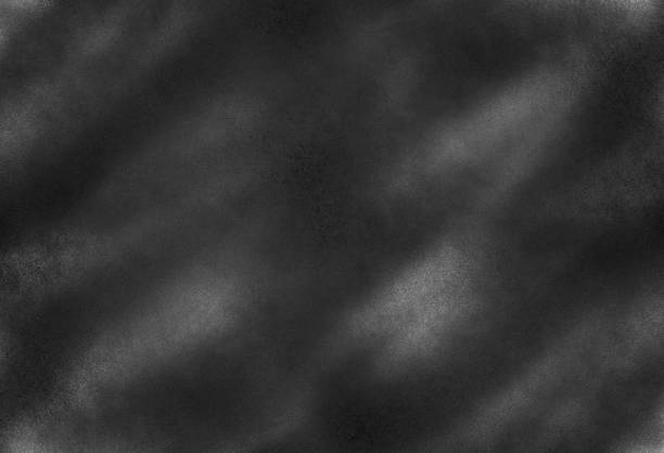 istock Dark noise texture. Gritty grunge background with black paint spots on paper 1172134617