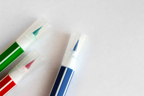 istock Red green blue felt-tip pens lie on a white sheet 1172135673