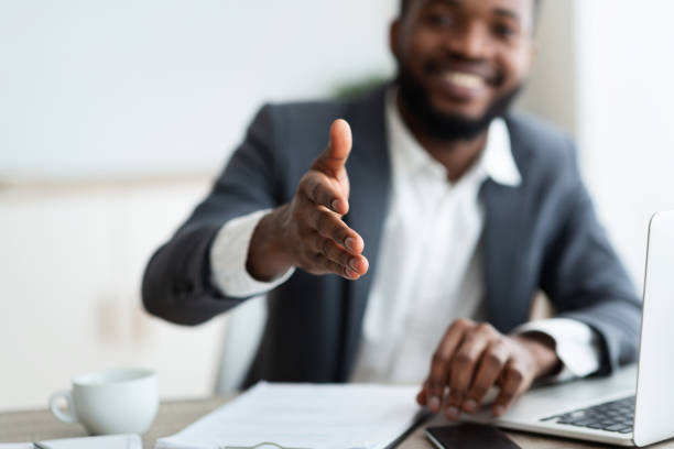 istock African American entrepreneur extending hand to shake 1172137012