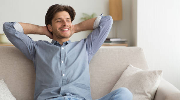 istock Happy Guy Relaxing Sitting On Sofa At Home 1172137861
