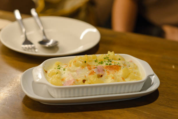 istock macaroni carbonara with ham and cheese on table 1172138404
