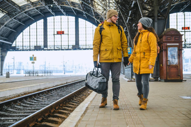 istock couple at railway station wiring for train 1172138565